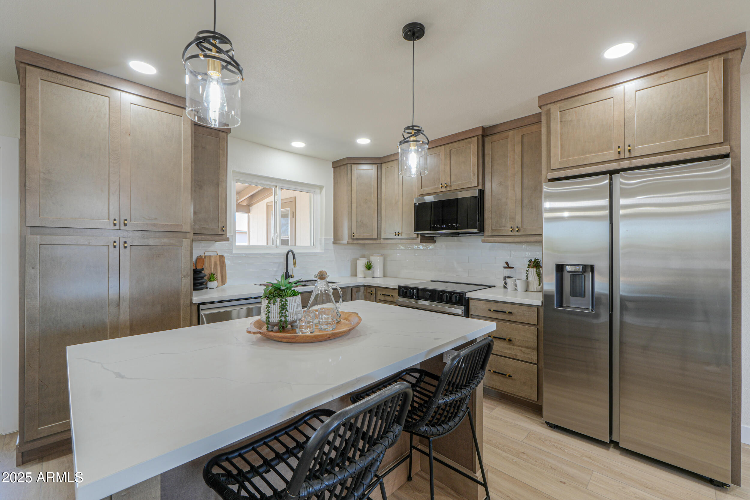 6502 East Rustic Drive Mesa, AZ 85215 - Photo 7 of 40 a kitchen with refrigerator a sink dining table and chairs