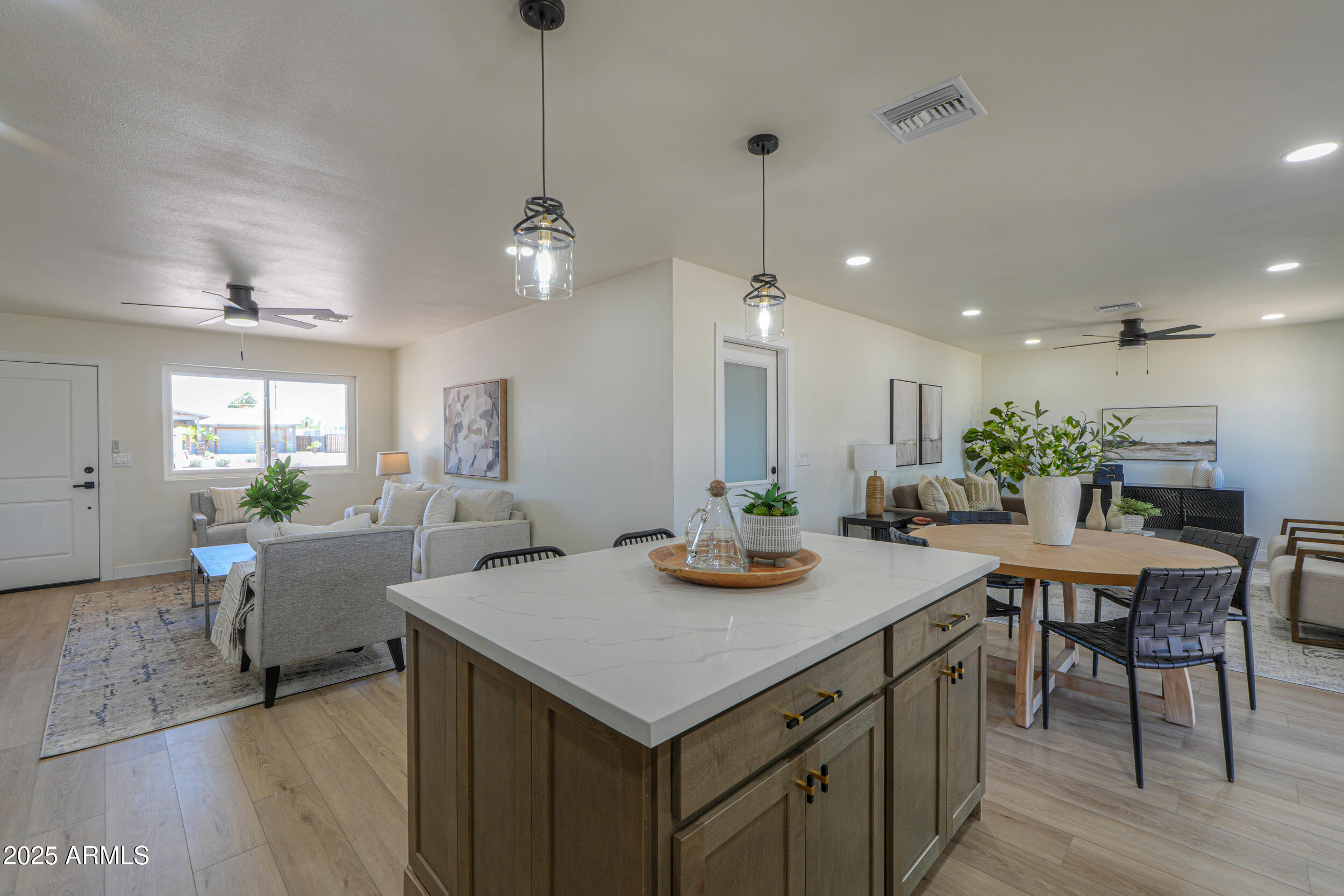 6502 East Rustic Drive Mesa, AZ 85215 - Photo 8 of 40 a view of a dining room with furniture window and wooden floor