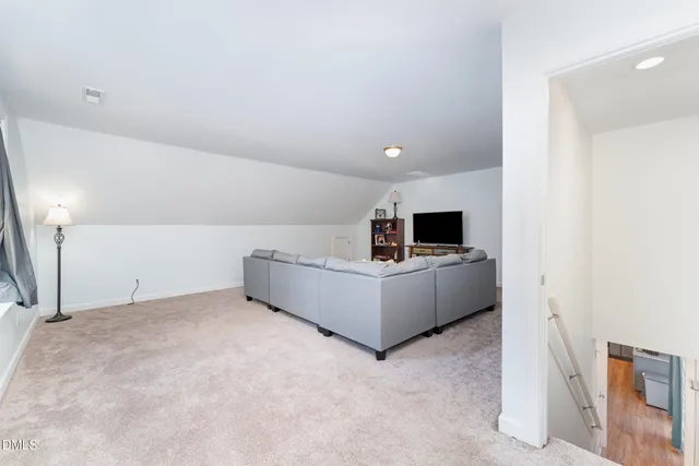 a living room with a couch and a flat screen tv