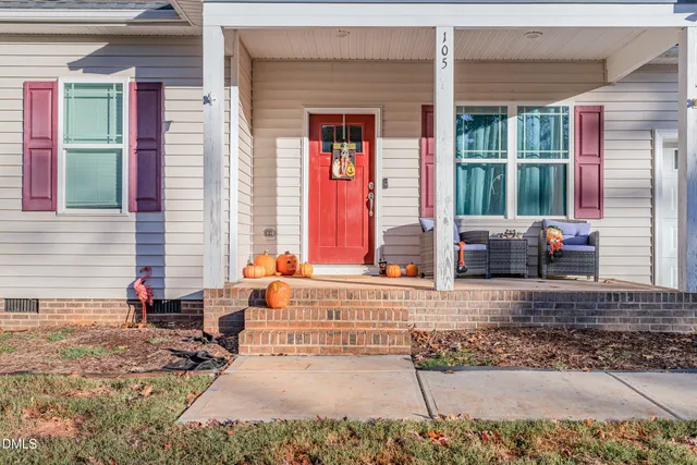 a view of a brick house with large windows