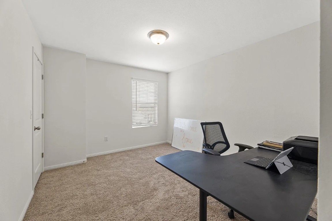 19605 Caymus Drive Pflugerville, TX 78660 - Photo 17 of 26 Office space featuring light carpet and baseboards
