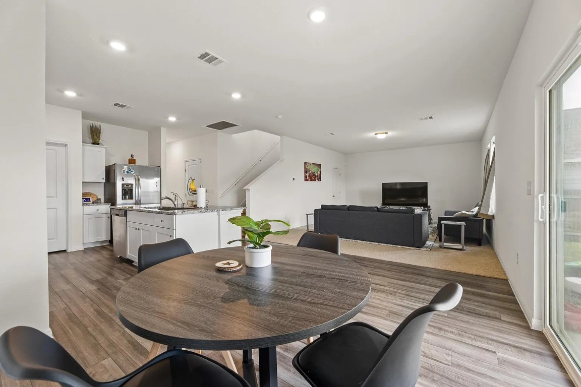 19605 Caymus Drive Pflugerville, TX 78660 - Photo 9 of 26 Dining area featuring light wood-style flooring and recessed lighting