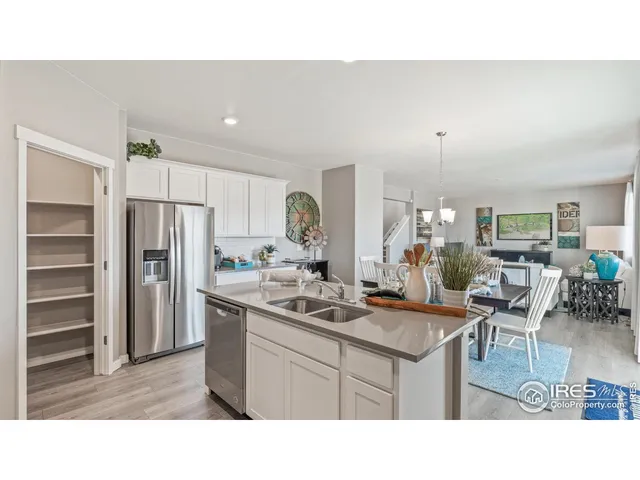 a kitchen with a sink stove and refrigerator