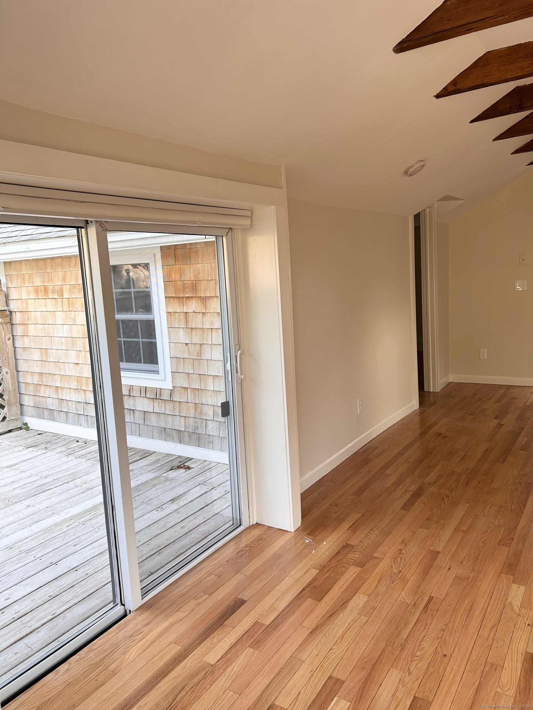 6-5 5th Street, Unit 6 Madison, CT 06443 - Photo 16 of 29 a view of wooden floor in a room