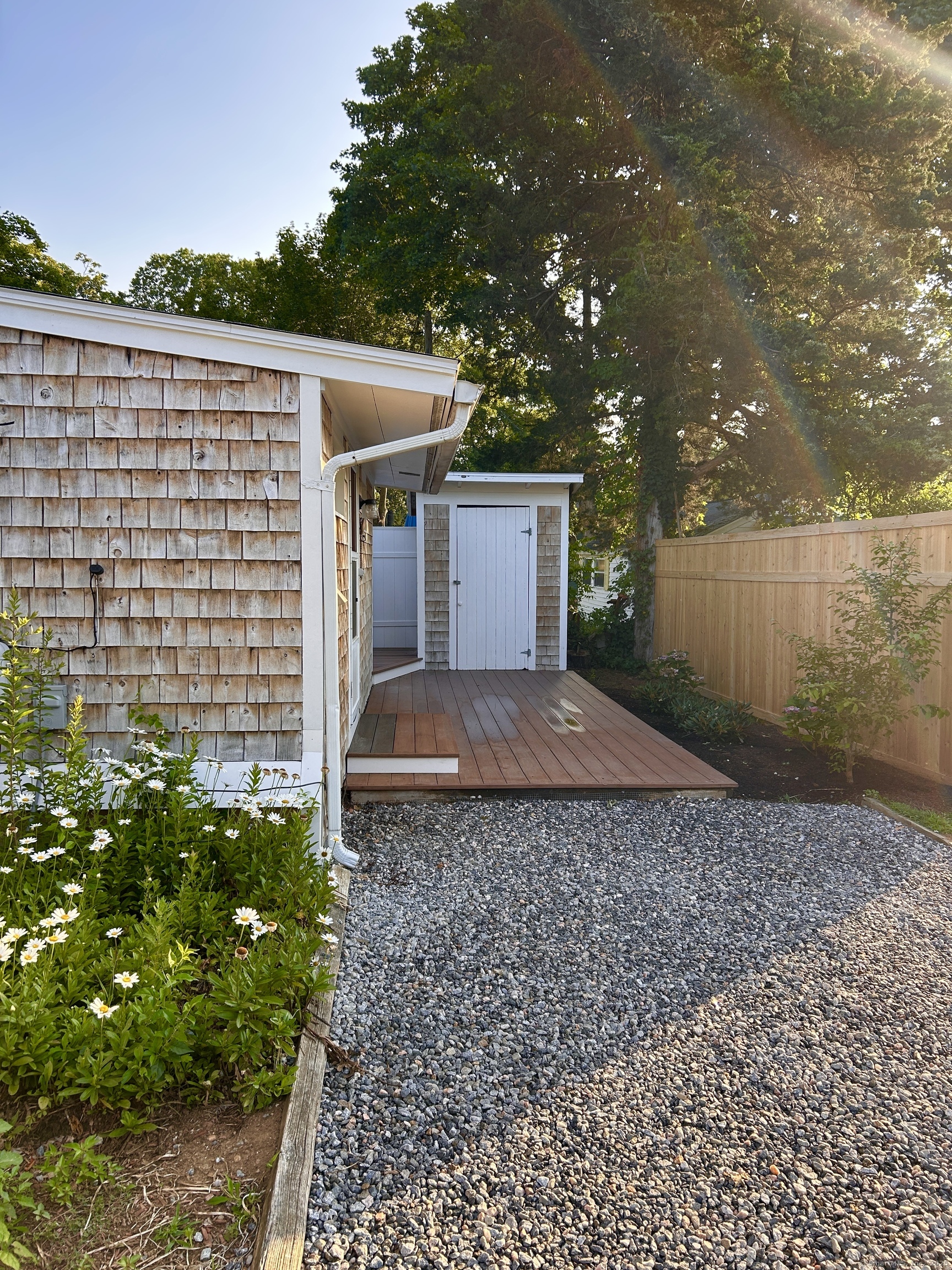 6-5 5th Street, Unit 6 Madison, CT 06443 - Photo 18 of 29 a view of a house with a yard