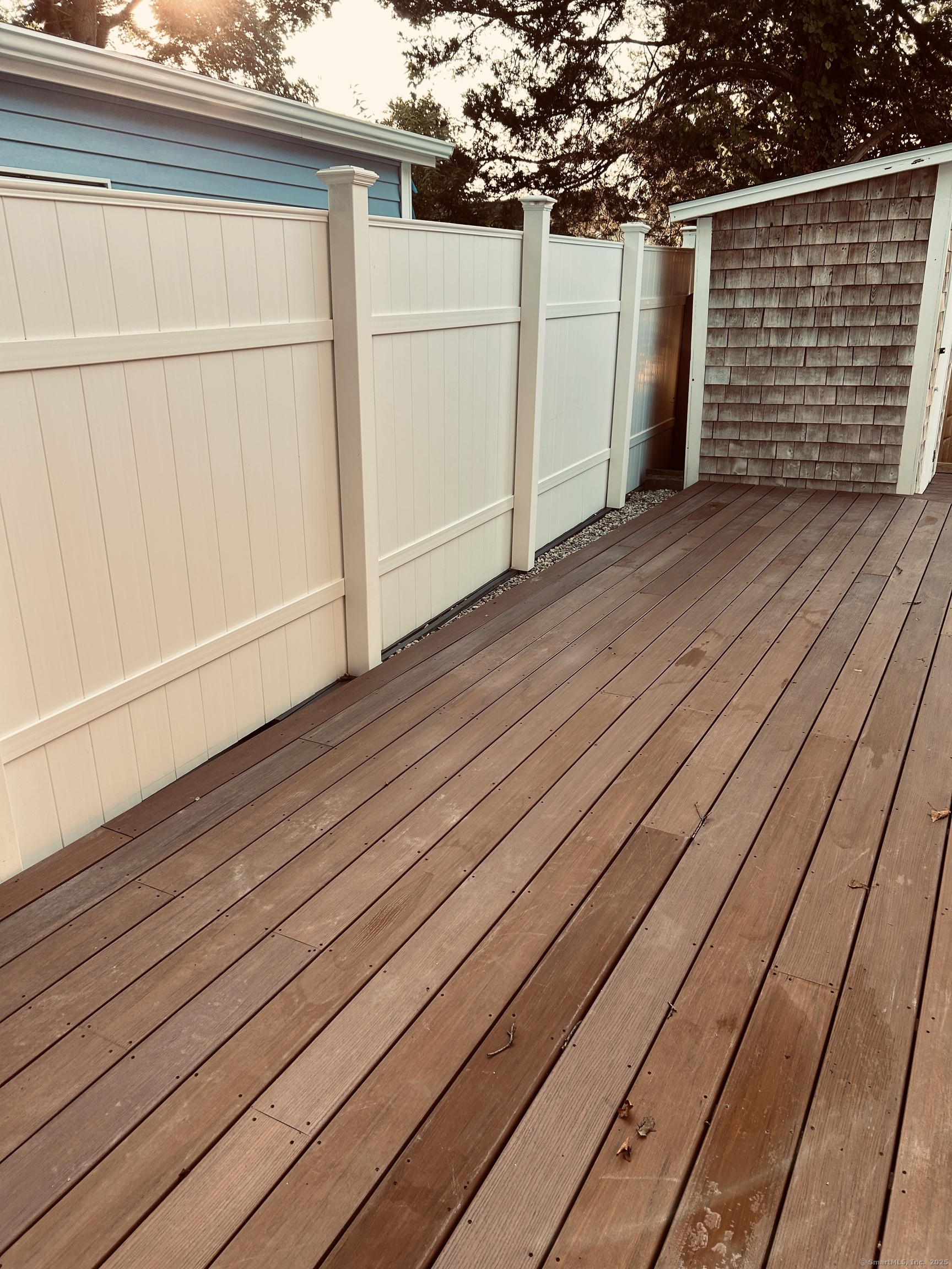 6-5 5th Street, Unit 6 Madison, CT 06443 - Photo 21 of 29 a view of a backyard of the house