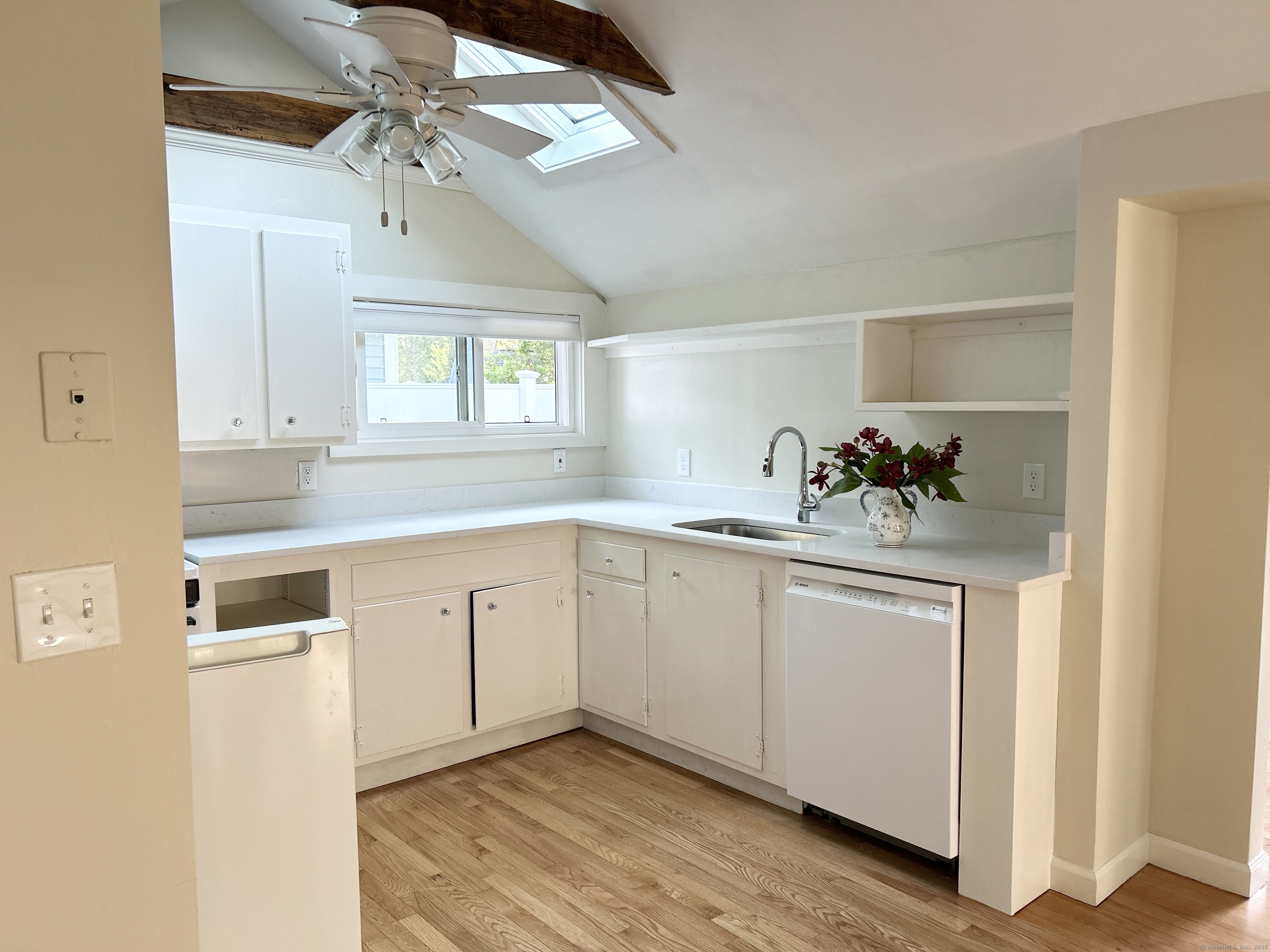6-5 5th Street, Unit 6 Madison, CT 06443 - Photo 7 of 29 a kitchen with a sink cabinets and window