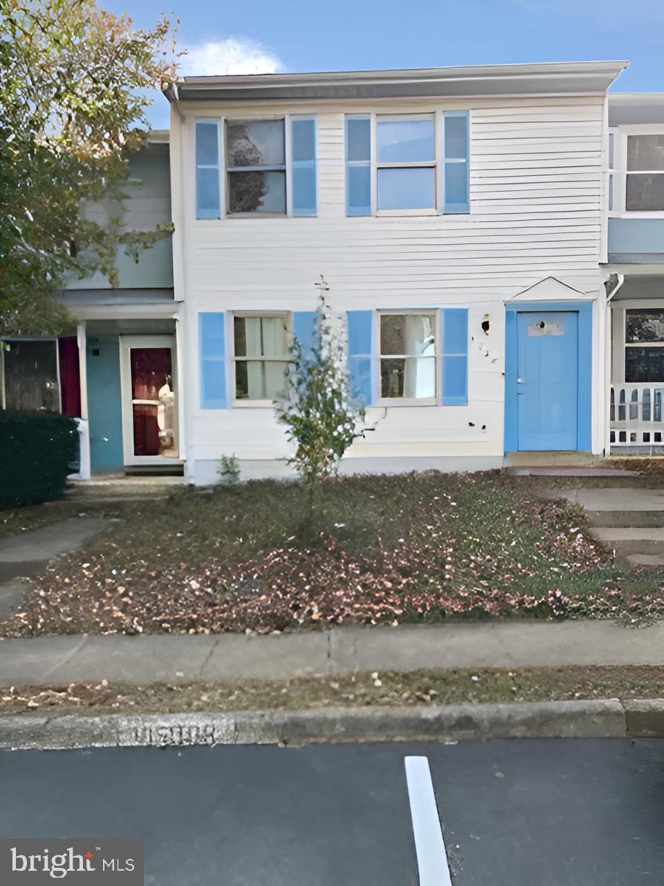 5140 Redbud Road Fredericksburg, VA 22407 - Photo 3 of 8 a front view of a house with a yard