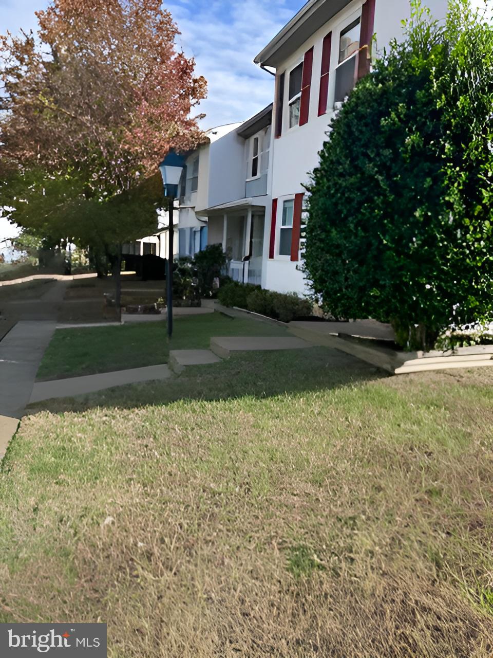 5140 Redbud Road Fredericksburg, VA 22407 - Photo 6 of 8 a view of a house with a yard and a street