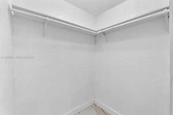 a view of an empty walk in closet