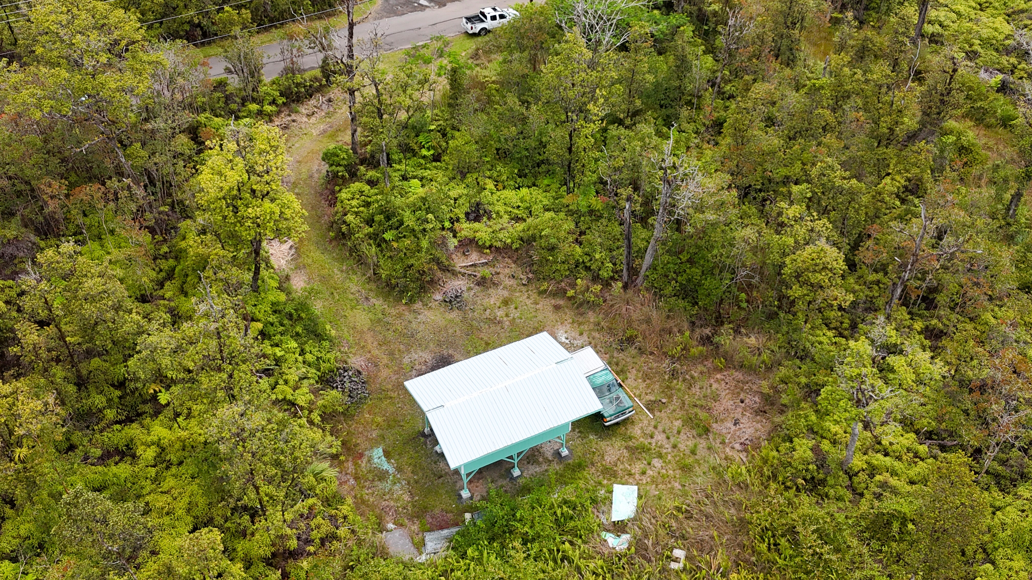 21 Palainui Street Pahoa, HI 96778 - Photo 2 of 8 an aerial view of a house with a yard