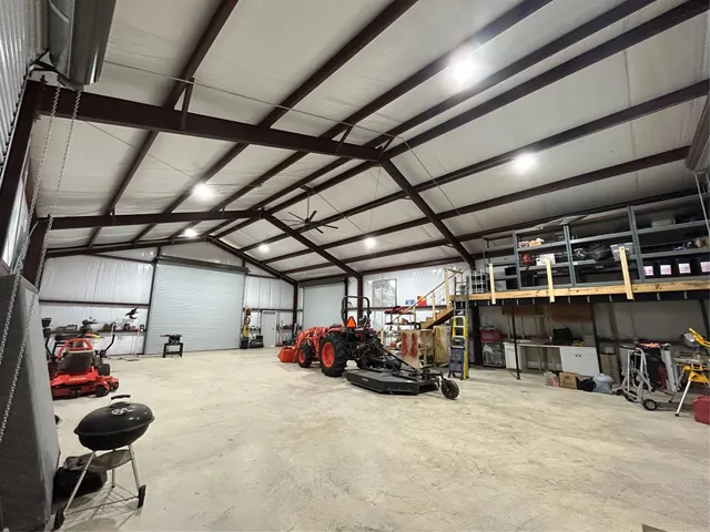a view of parking garage with cars