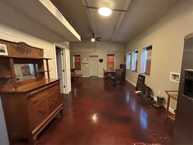a kitchen with a stove sink and cabinets