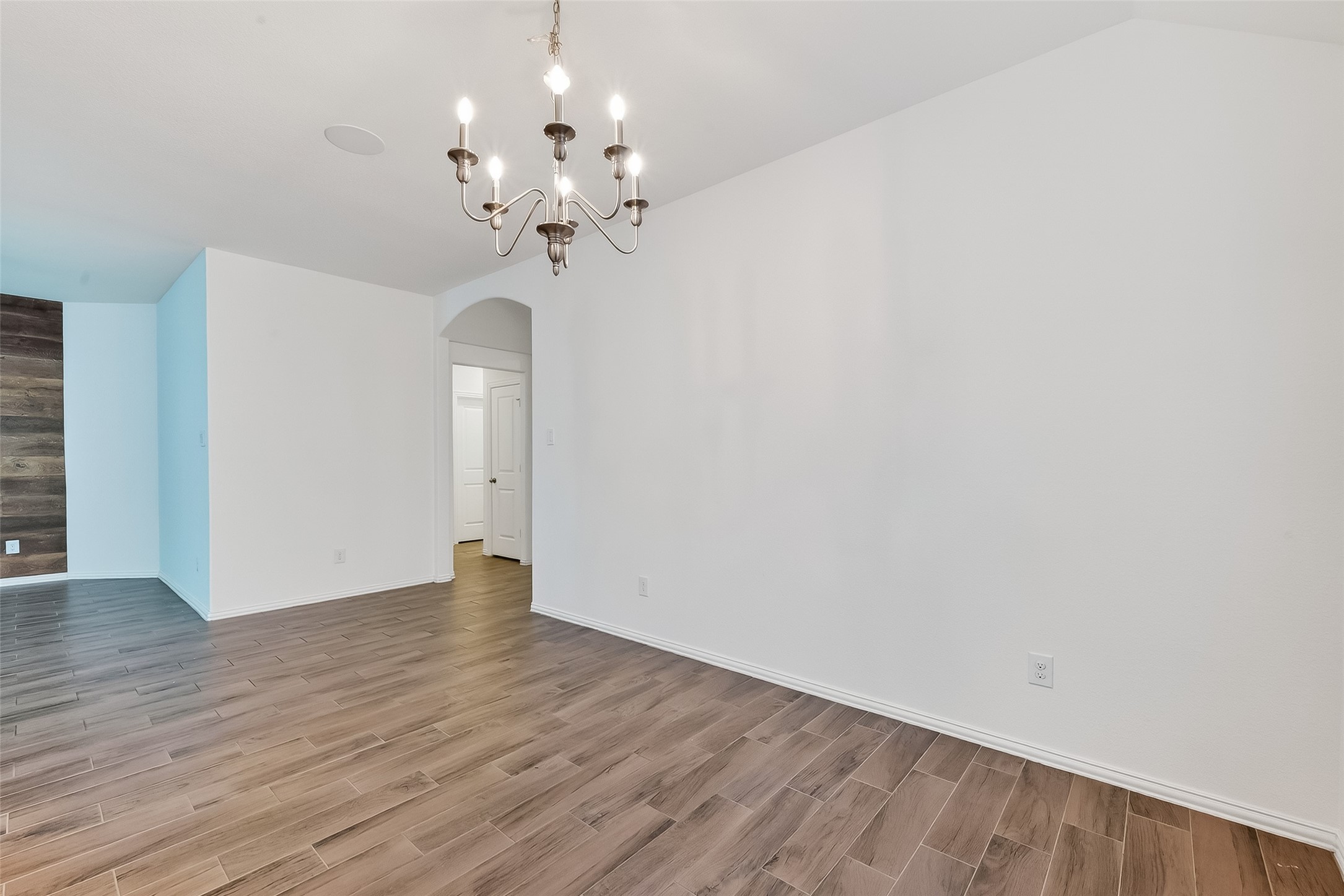 210 Emory Birch Montgomery, TX 77316 - Photo 13 of 48 a view of an empty room with wooden floor
