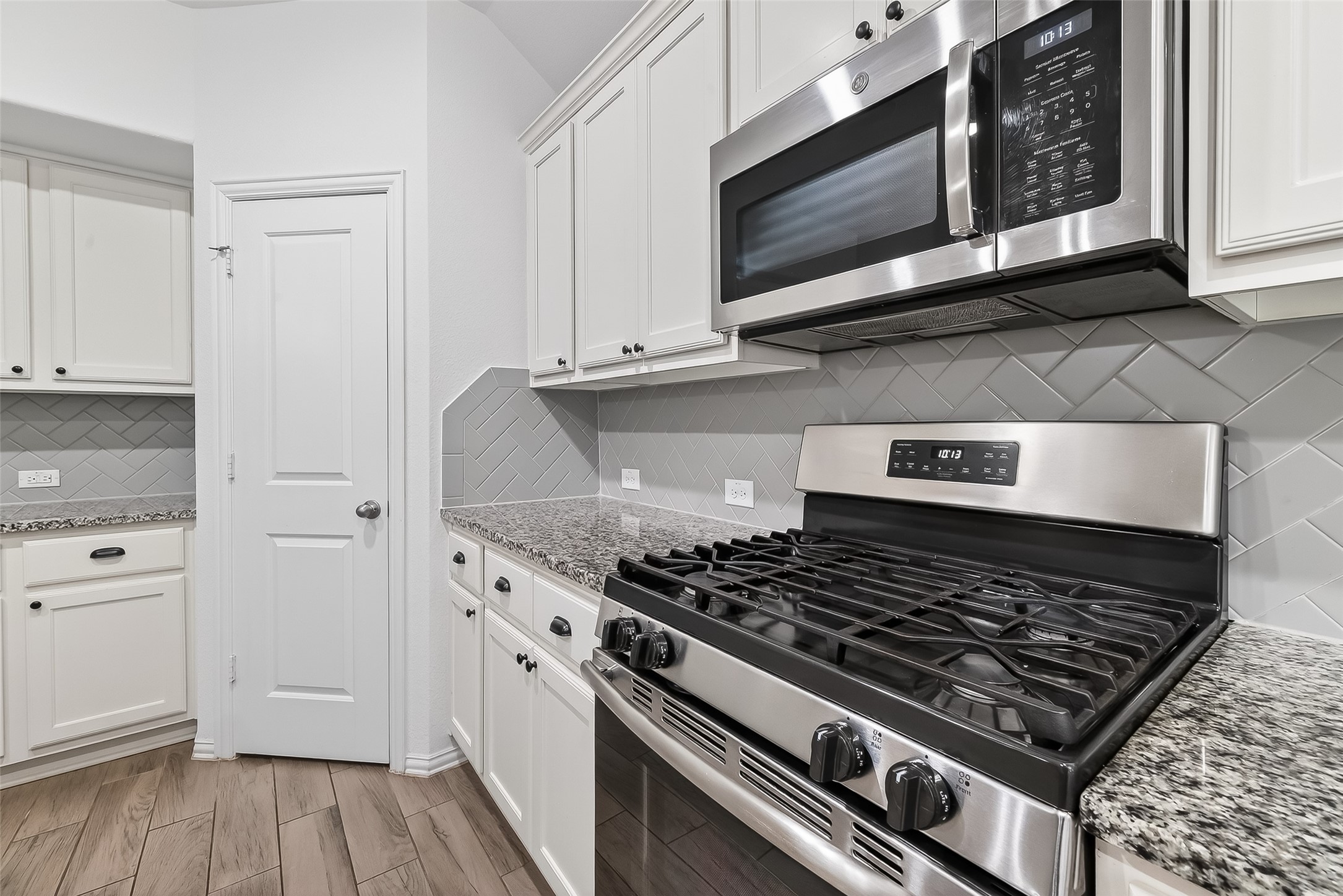 210 Emory Birch Montgomery, TX 77316 - Photo 20 of 48 a stove top oven sitting inside of a kitchen