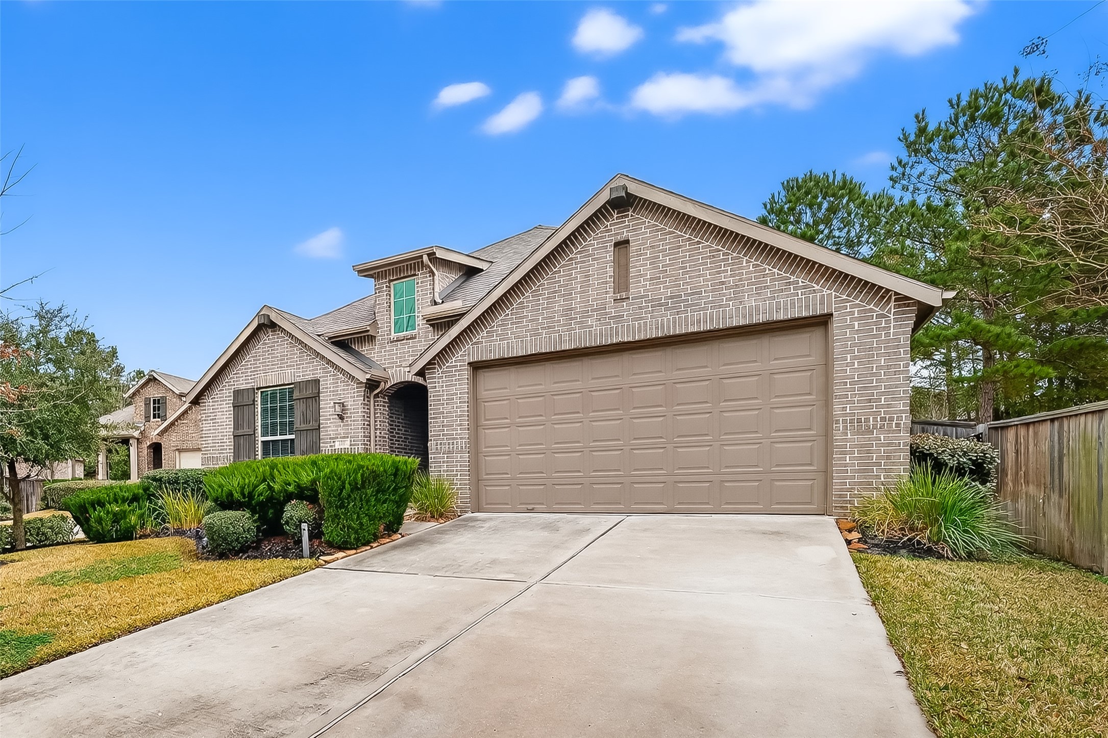 210 Emory Birch Montgomery, TX 77316 - Photo 2 of 48 a front view of house with yard and trees in the background