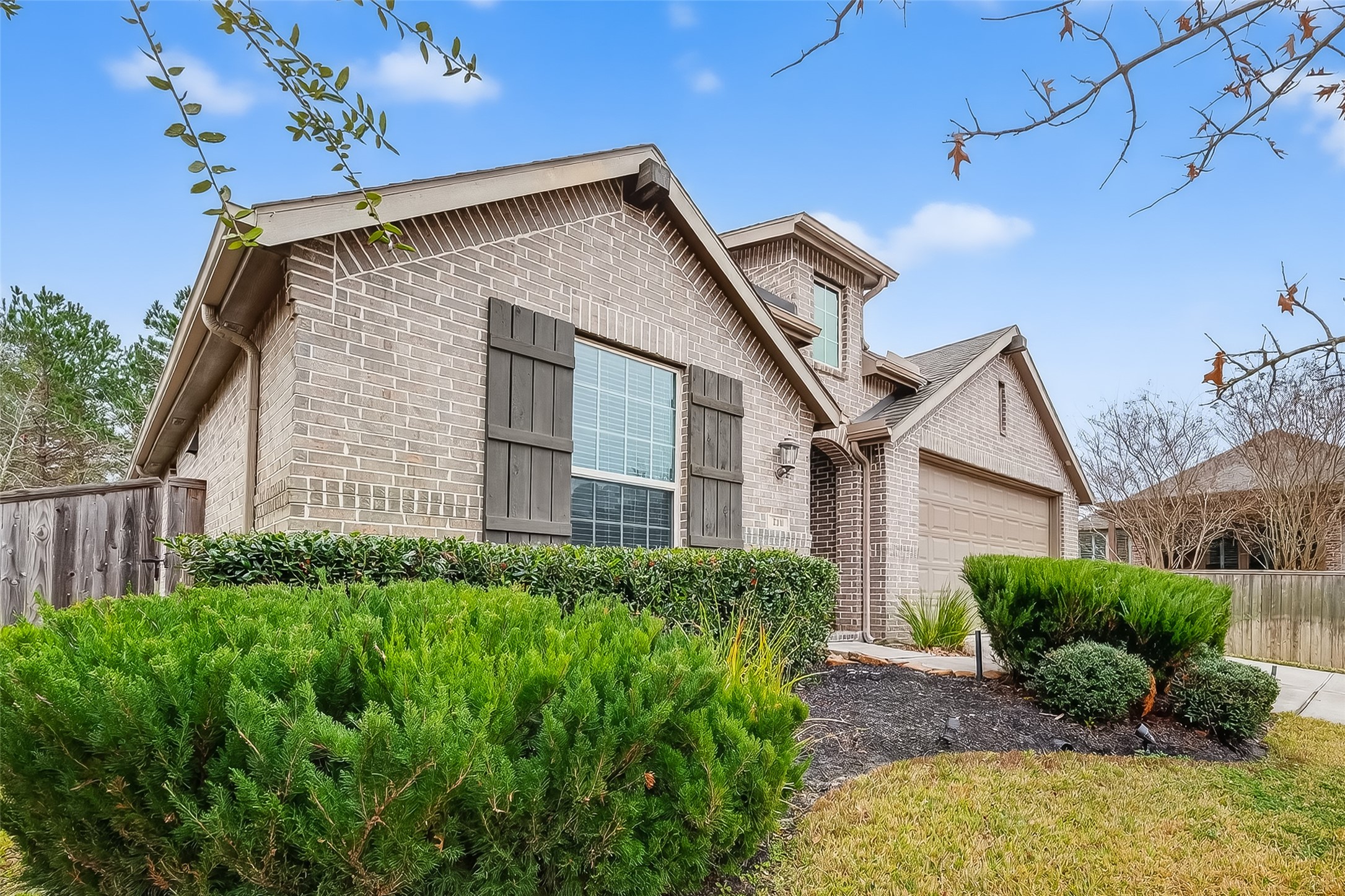 210 Emory Birch Montgomery, TX 77316 - Photo 3 of 48 a front view of a house with a yard