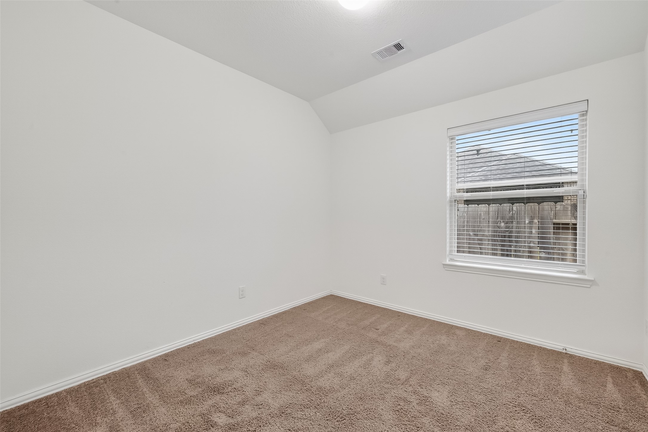 210 Emory Birch Montgomery, TX 77316 - Photo 32 of 48 an empty room with a window