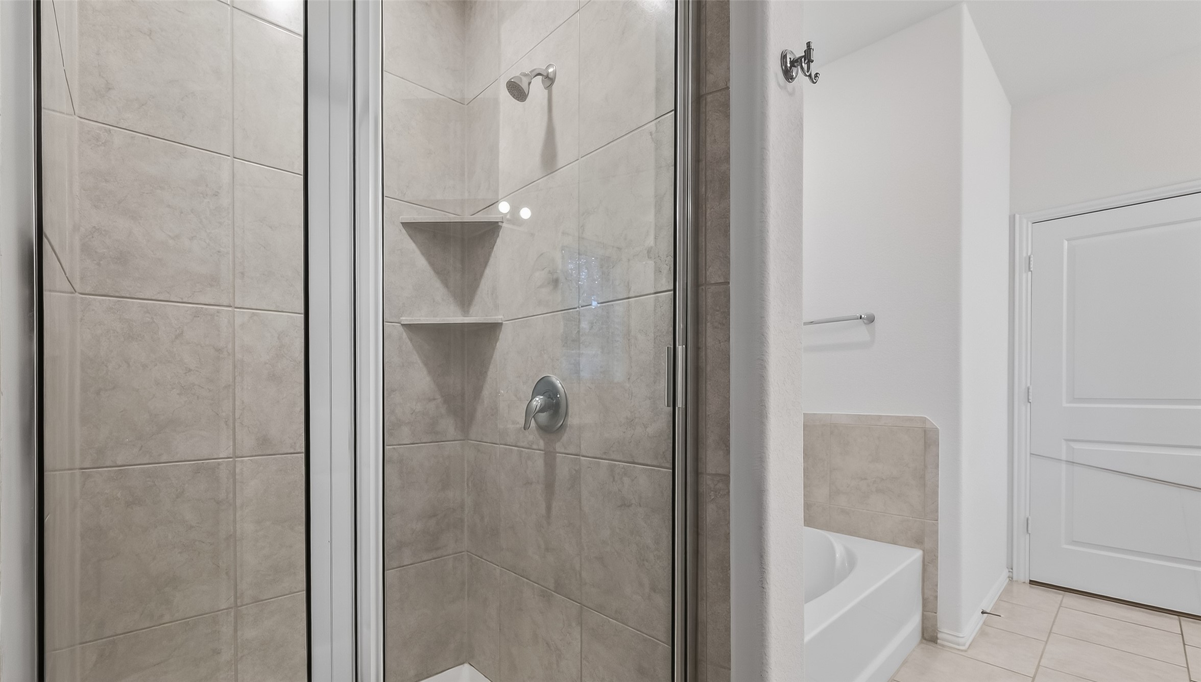 210 Emory Birch Montgomery, TX 77316 - Photo 39 of 48 a bathroom with a glass shower door