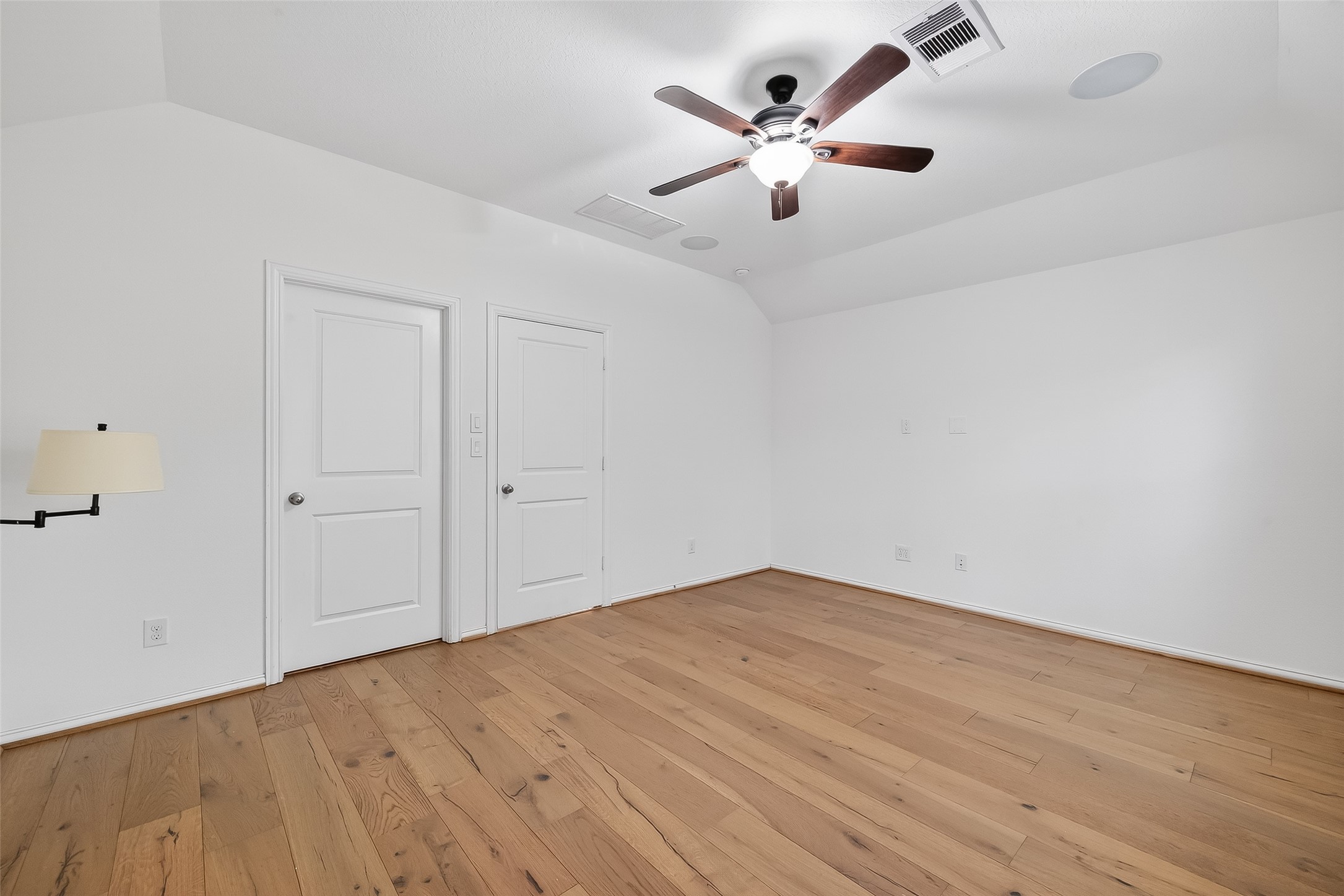 210 Emory Birch Montgomery, TX 77316 - Photo 43 of 48 an empty room with wooden floor and ceiling fan