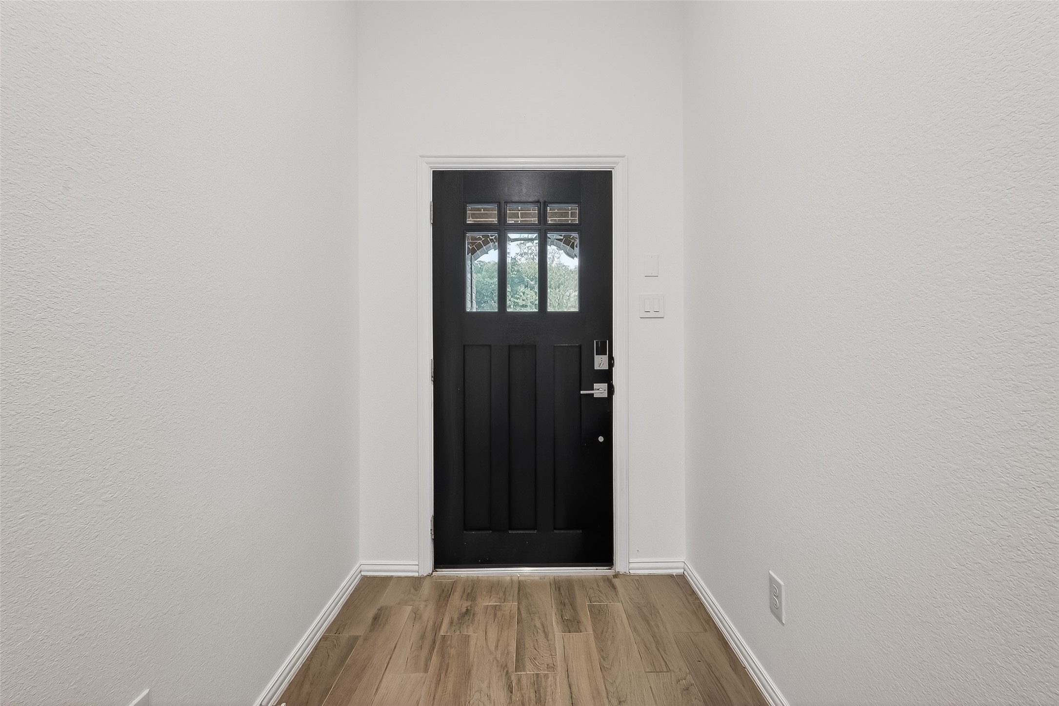 210 Emory Birch Montgomery, TX 77316 - Photo 6 of 48 a view of a hallway with wooden floor