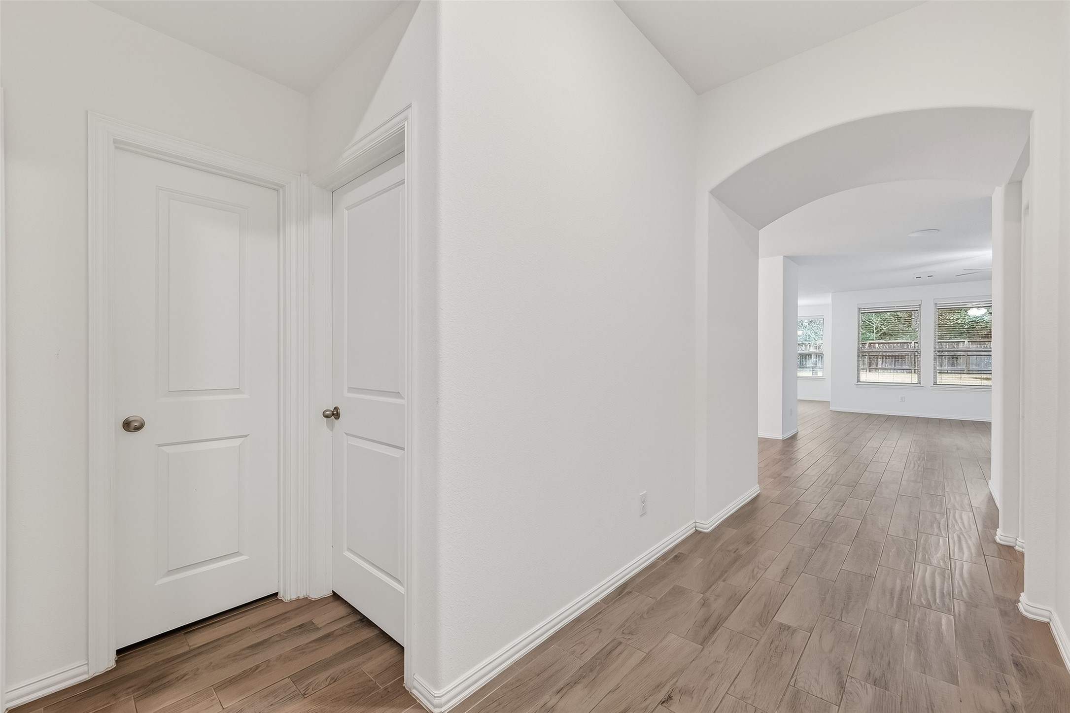 210 Emory Birch Montgomery, TX 77316 - Photo 7 of 48 a view of a hallway with wooden floor