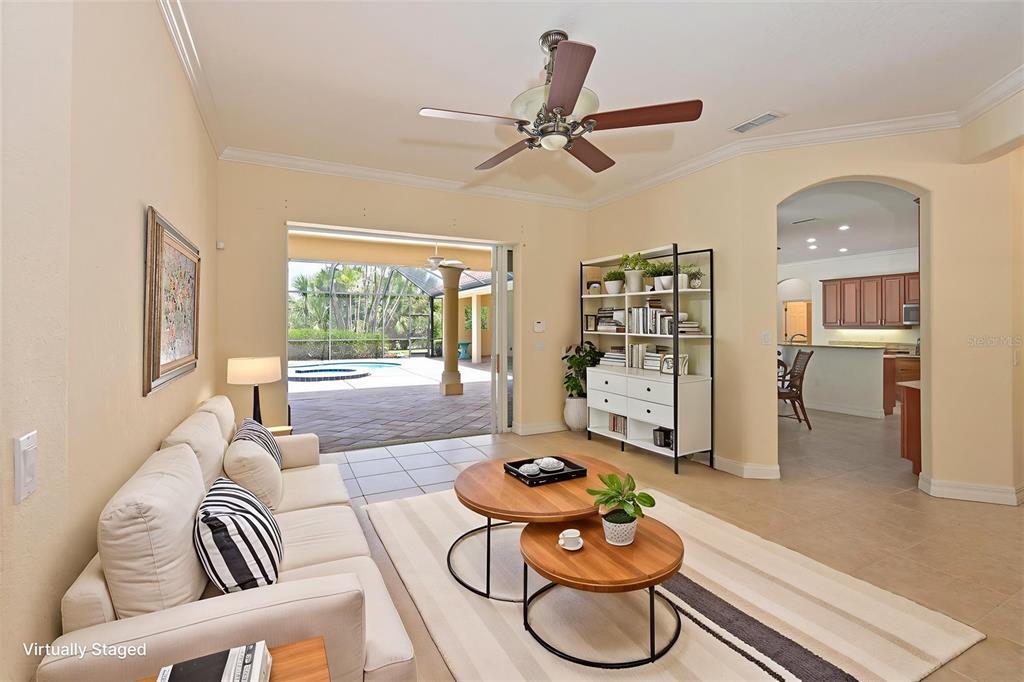 10622 Conch Shell Terrace Bradenton, FL 34212 - Photo 20 of 69 a living room with furniture and a large window