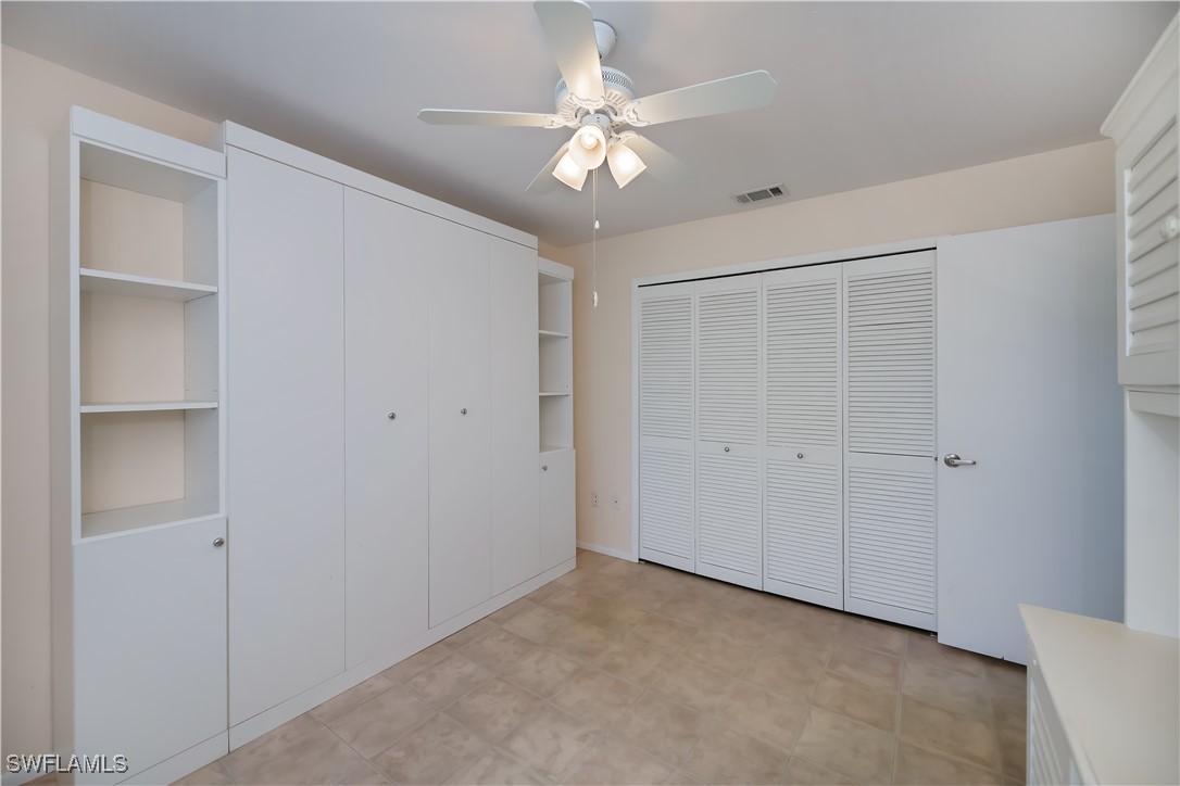 1100 Pondella Road, Unit 514 Cape Coral, FL 33909 - Photo 23 of 35 a view of an empty room with a ceiling fan