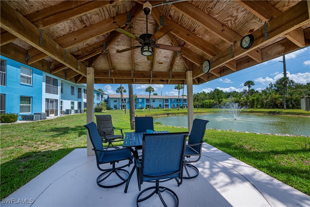 1100 Pondella Road, Unit 514 Cape Coral, FL 33909 - Photo 3 of 35 a view of a chairs and table in patio with a yard