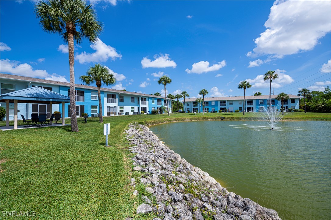 1100 Pondella Road, Unit 514 Cape Coral, FL 33909 - Photo 7 of 35 a view of a lake with a house in the background