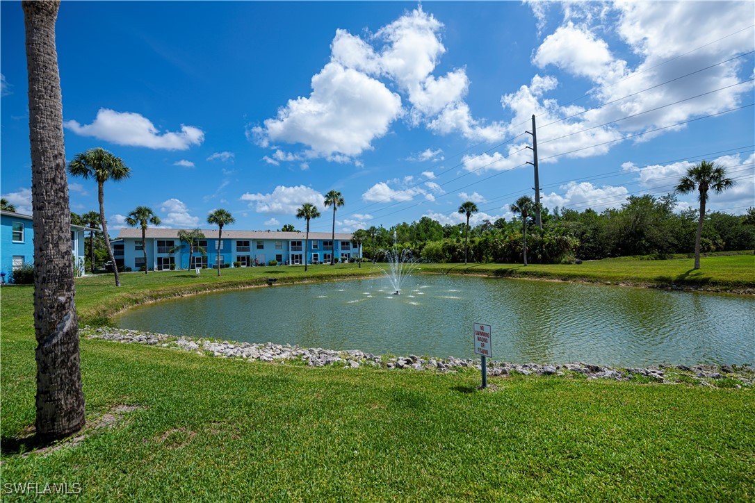 1100 Pondella Road, Unit 514 Cape Coral, FL 33909 - Photo 8 of 35 a view of a lake with houses in the background