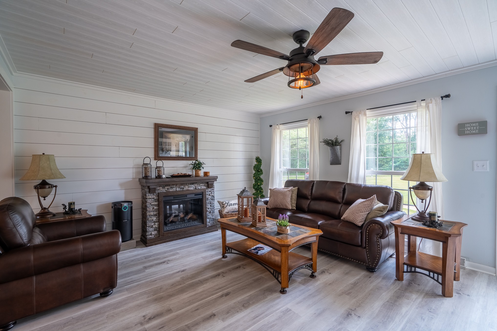 12 Horseshoe Bend Road Leoma, TN 38468 - Photo 1 of 51 a living room with furniture a fireplace and a flat screen tv