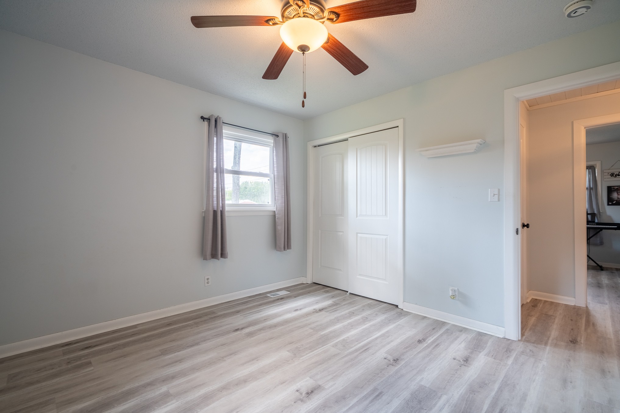12 Horseshoe Bend Road Leoma, TN 38468 - Photo 29 of 51 wooden floor in an empty room with a window
