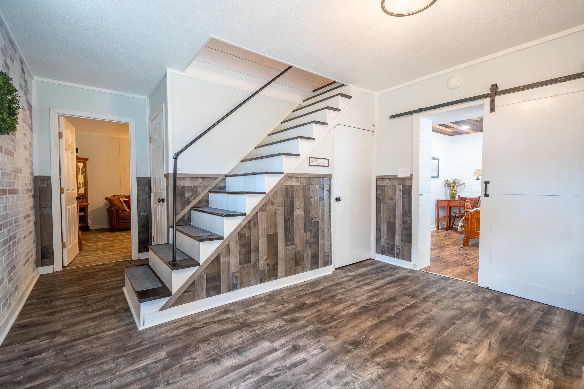 12 Horseshoe Bend Road Leoma, TN 38468 - Photo 35 of 51 a view of a hallway with wooden floor and staircase