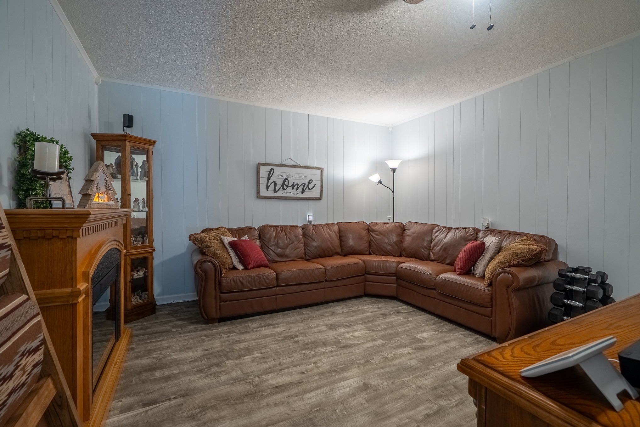 12 Horseshoe Bend Road Leoma, TN 38468 - Photo 36 of 51 a living room with furniture a flat screen tv and a refrigerator