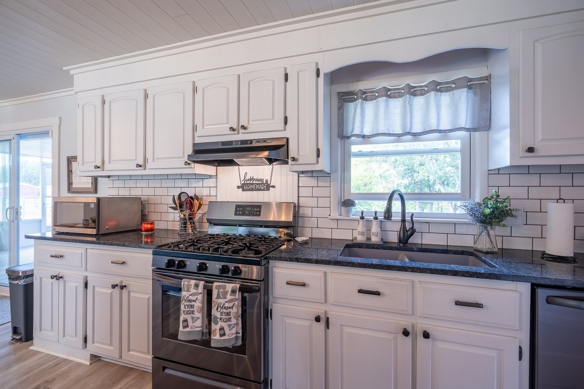 12 Horseshoe Bend Road Leoma, TN 38468 - Photo 4 of 51 a kitchen with stainless steel appliances granite countertop a sink a stove and cabinets