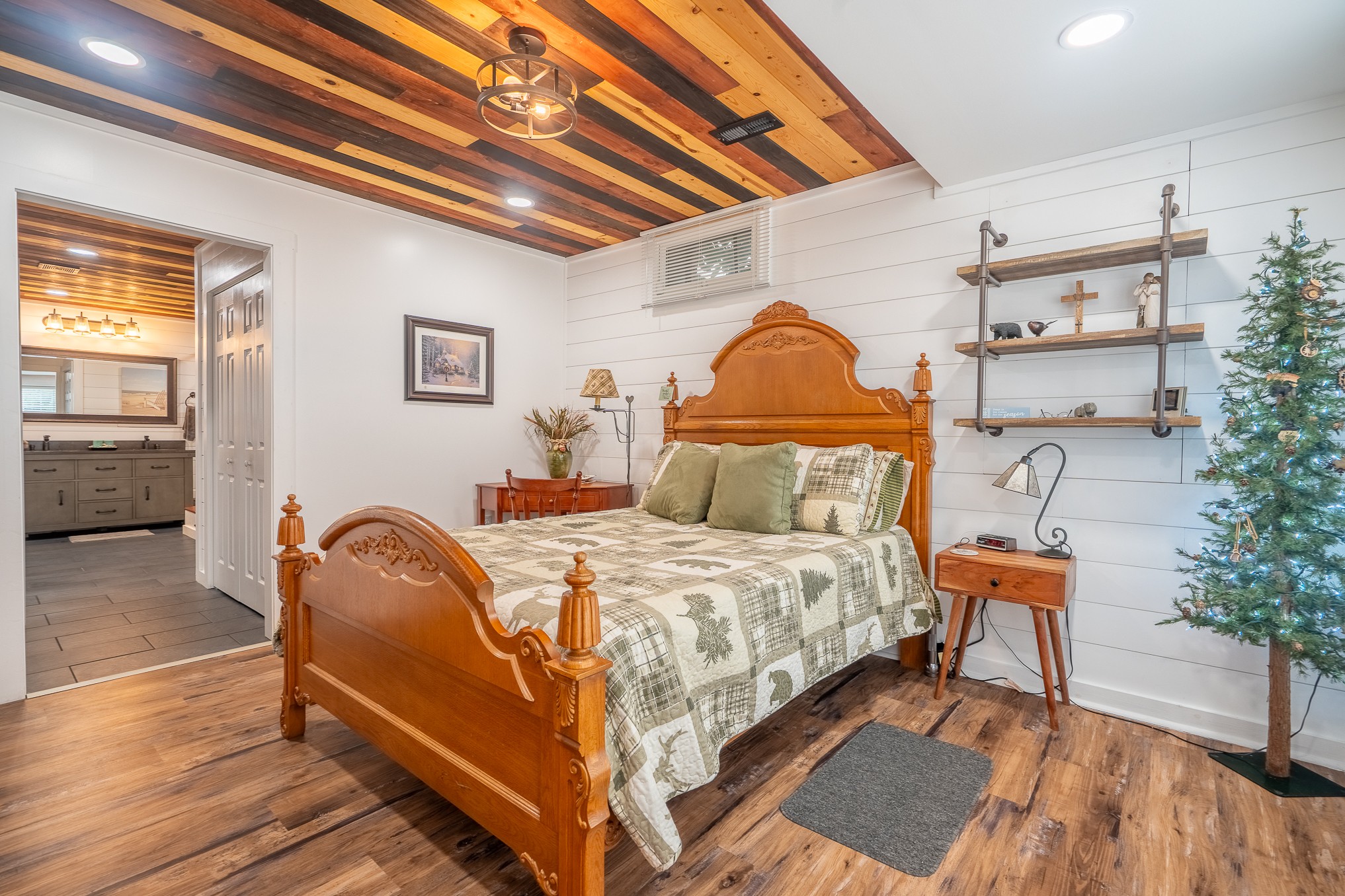 12 Horseshoe Bend Road Leoma, TN 38468 - Photo 42 of 51 a bedroom with a bed and wooden floor