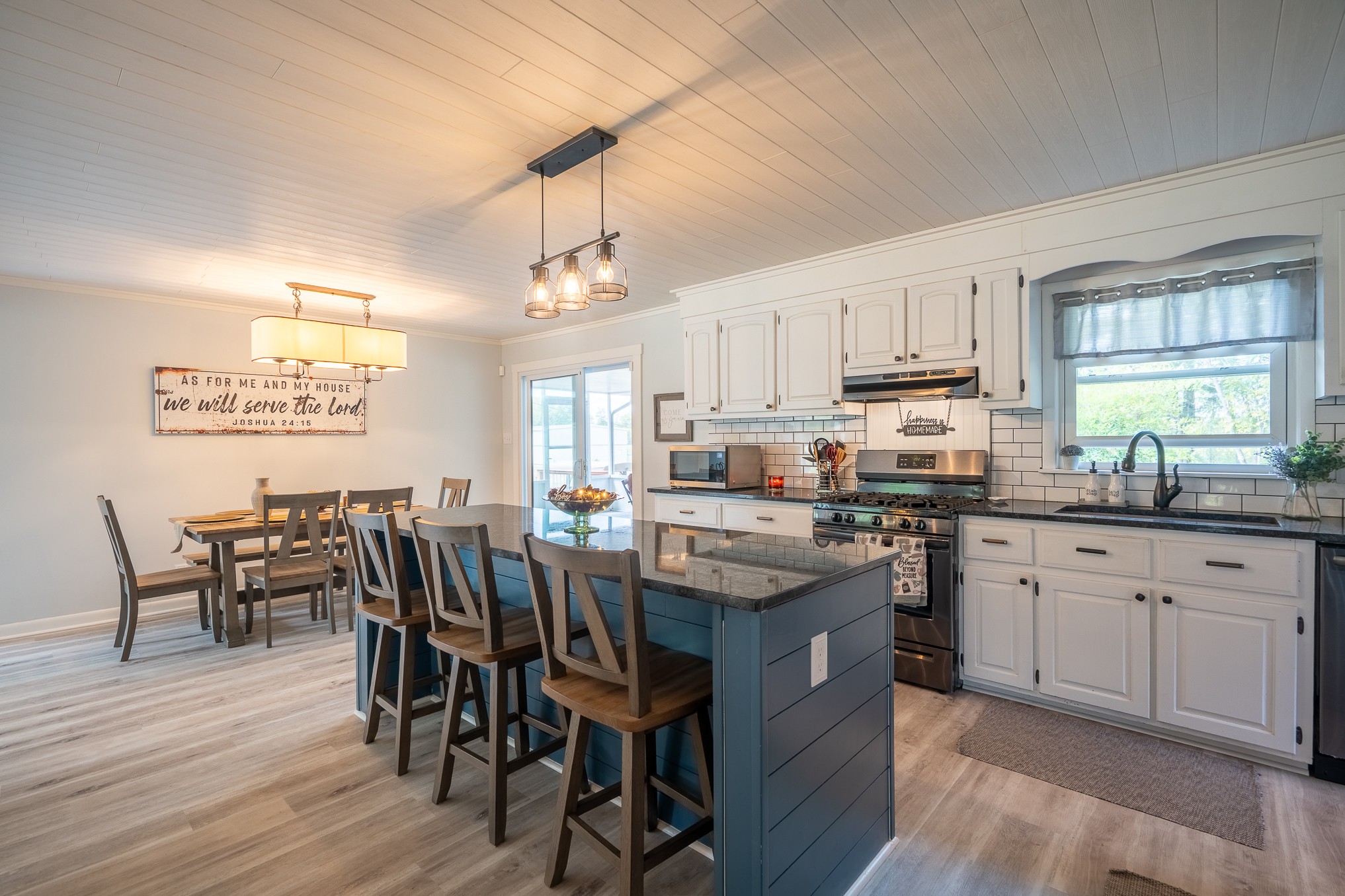 12 Horseshoe Bend Road Leoma, TN 38468 - Photo 6 of 51 a kitchen with stainless steel appliances granite countertop a table chairs sink refrigerator and cabinets