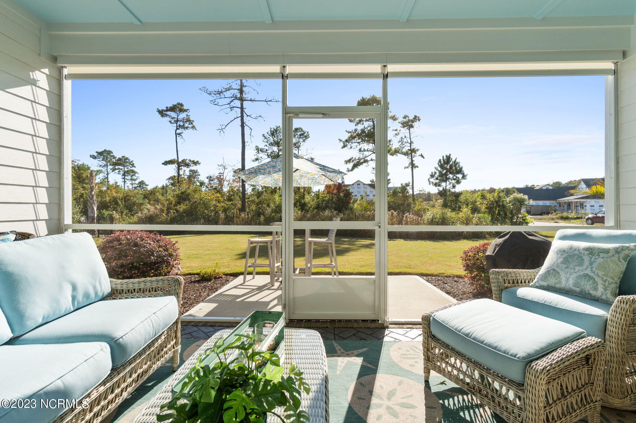 1398 Long Pond Road Southwest Ocean Isle Beach, NC 28469 - Photo 26 of 48 Screen porch has stamped concrete floor