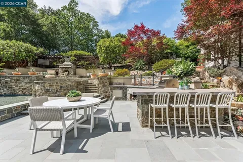 a view of a chairs and table in the patio