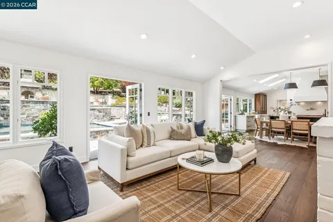 a living room with furniture or couch and a large window
