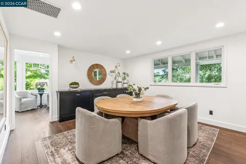 a living room with a sink and a window