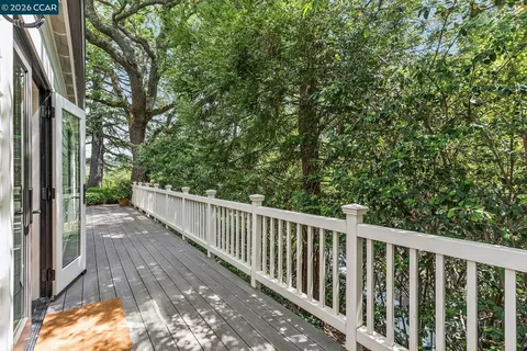 a view of balcony with wooden floor