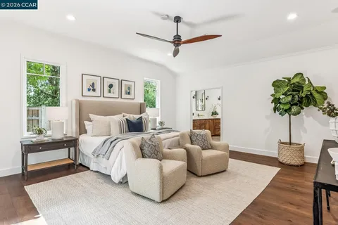 a bedroom with a bed furniture and a window