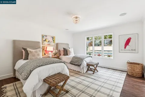 a bedroom with bed and window