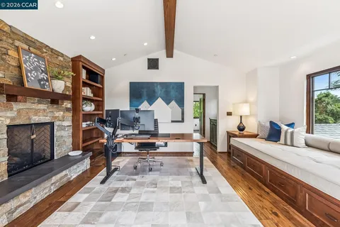 a bedroom with furniture and a window