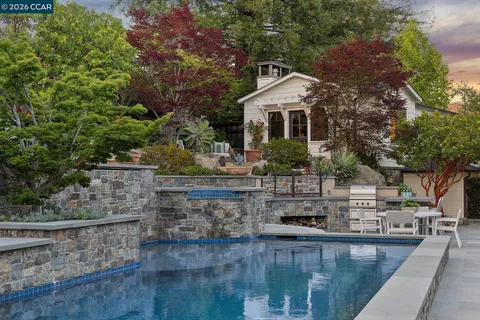 a front view of a house with swimming pool