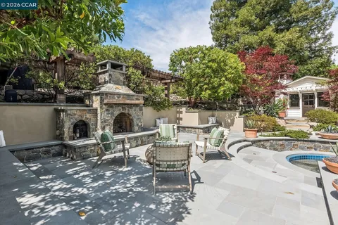 a view of a patio with couple of chairs