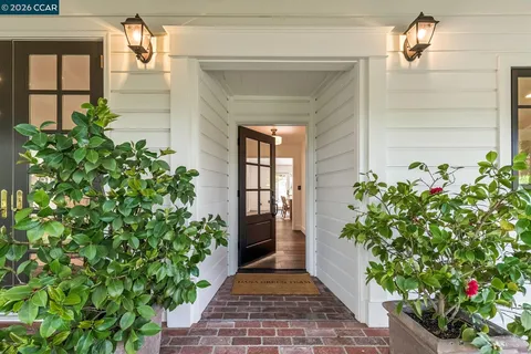 a hallway with flowers in front of house