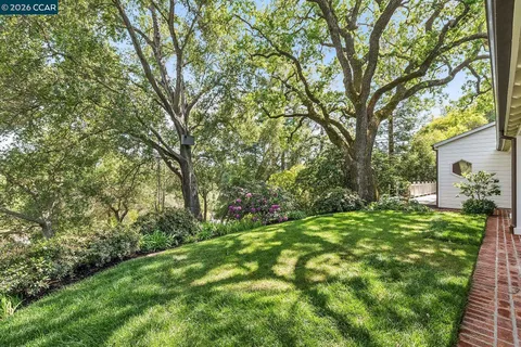 a backyard of a house with lots of green space